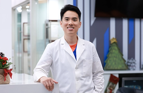 Orhtodontist Jeff Shao Smiling At Office Entrance