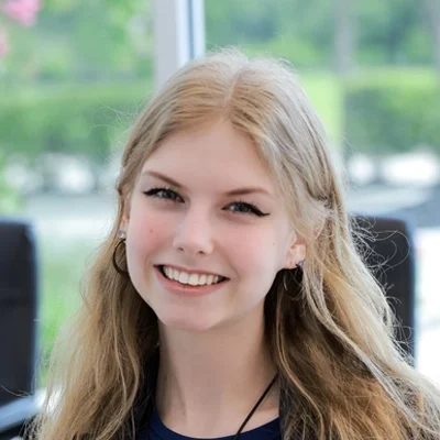 Bree smiling, she has blonde hair.